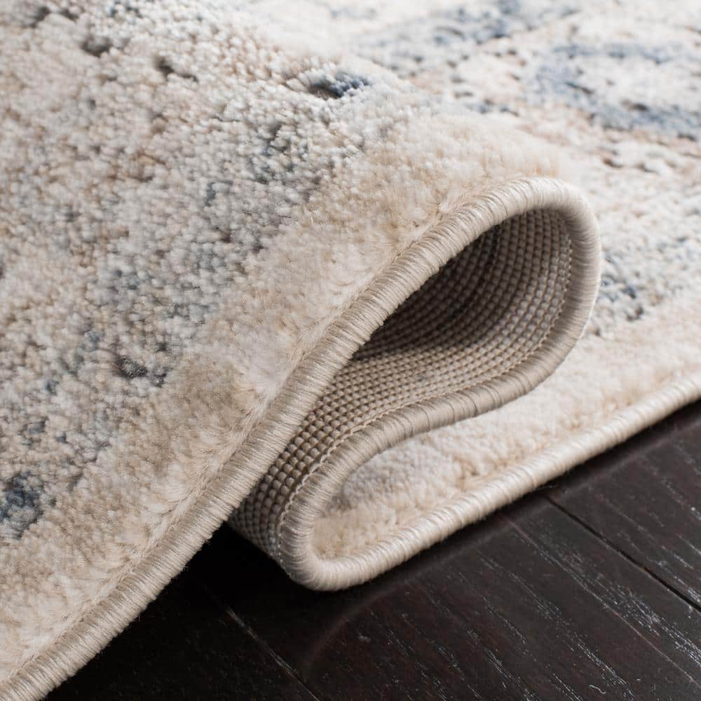 Ivory and Blue Floral Medallion 9' x 12' Synthetic Area Rug