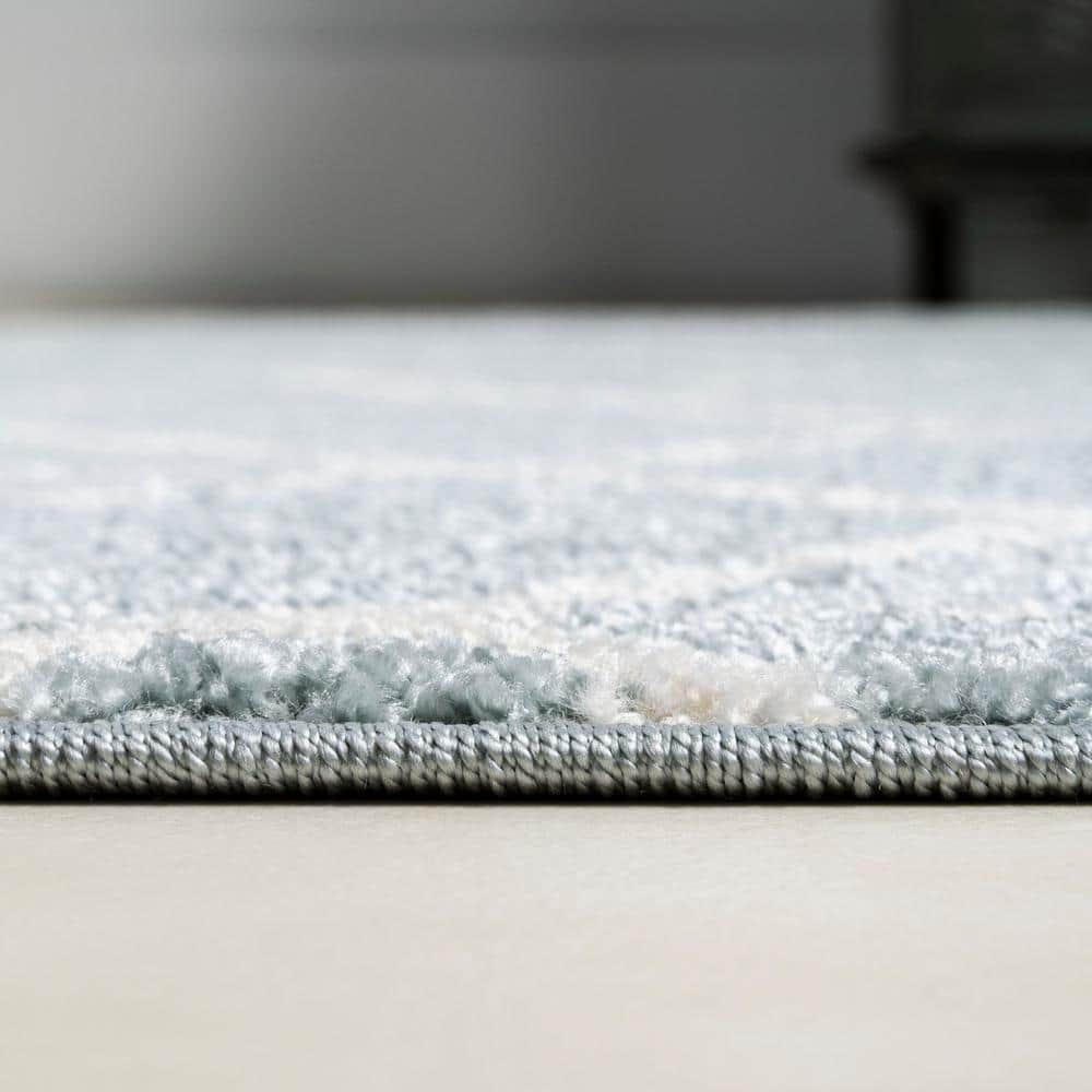 Light Blue and White Geometric 4' x 6' Area Rug