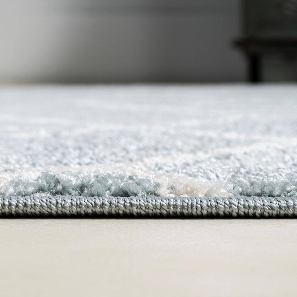 Light Blue and White Geometric 4' x 6' Area Rug