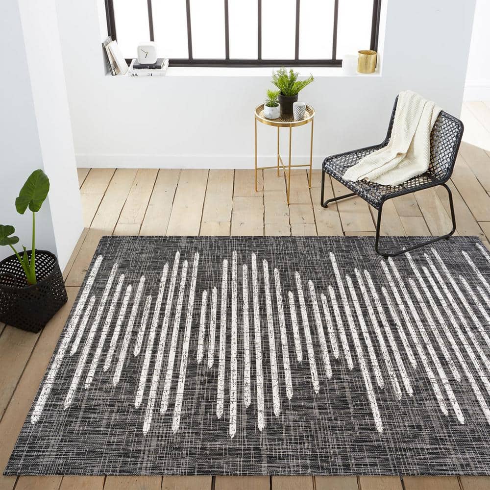 Zolak 4' x 6' Black and Ivory Synthetic Stripe Rug