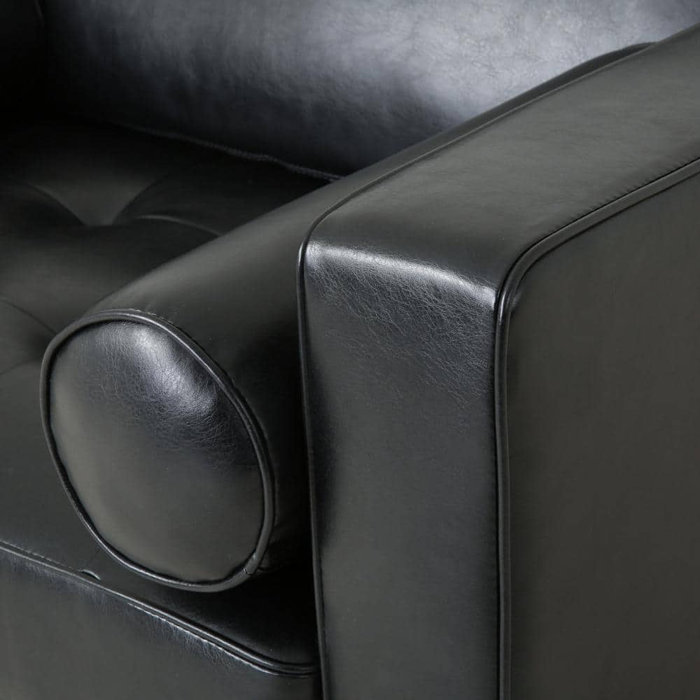 Close-up of bolster pillow and armrest on Noble House Portage Midnight Tufted Club Chair