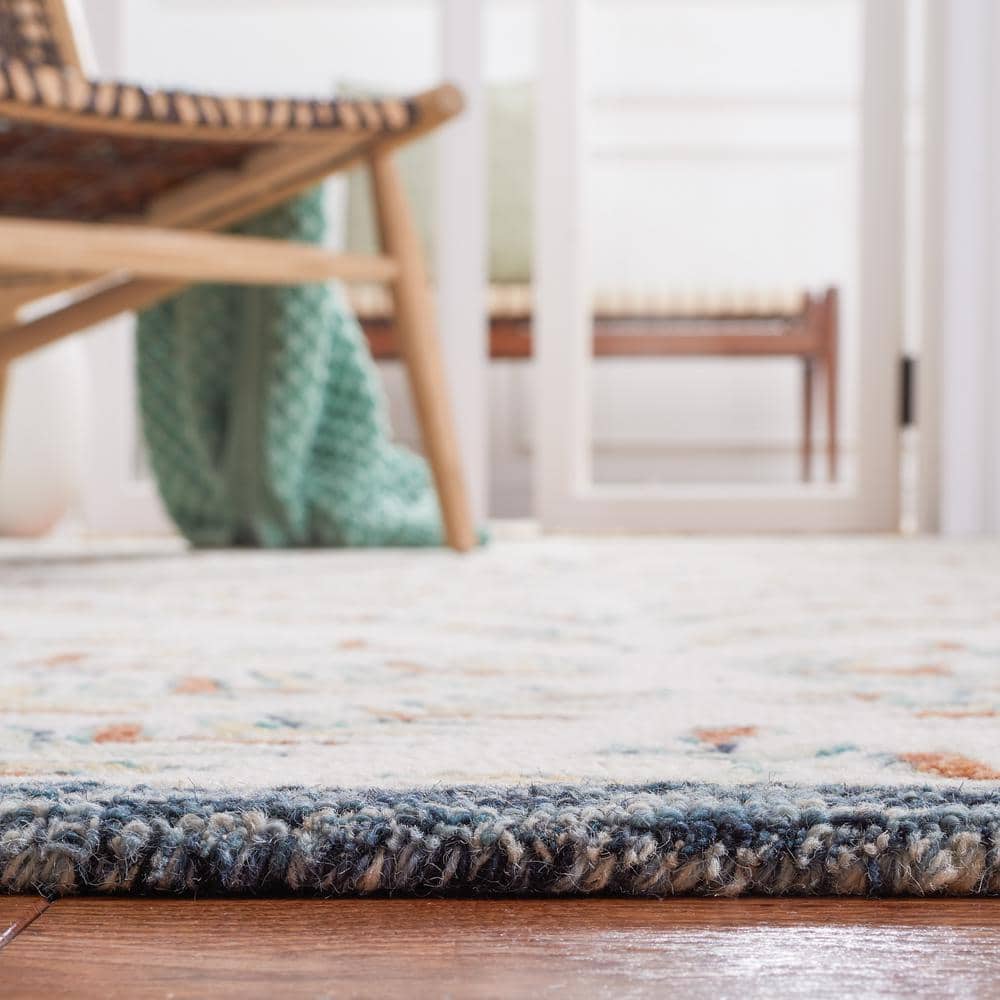 Hand-Tufted Ivory and Blue Wool 6' x 9' Area Rug
