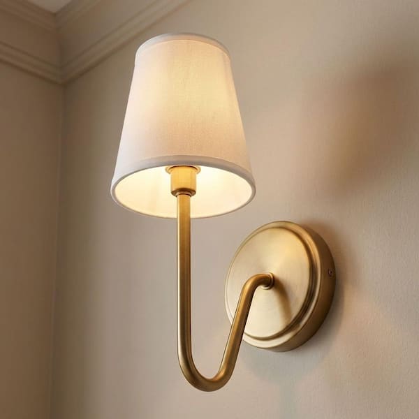 Meridian 4.75 in. W x 11.25 in. H 1-Light Natural Brass Wall Sconce with White Fabric Shade