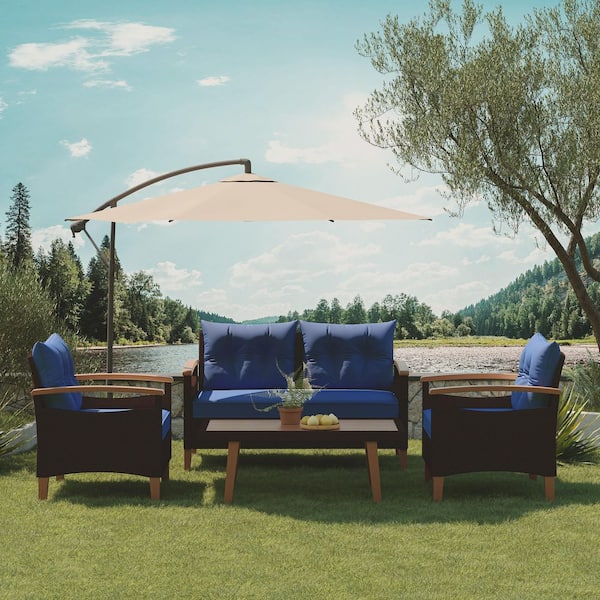 4-Piece Brown Wicker Patio Conversation Set with Blue Cushions and Pillows