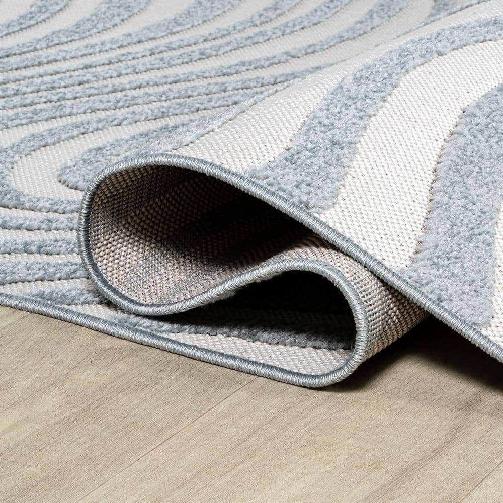 Light Blue and Ivory Abstract 4' x 6' Synthetic Area Rug