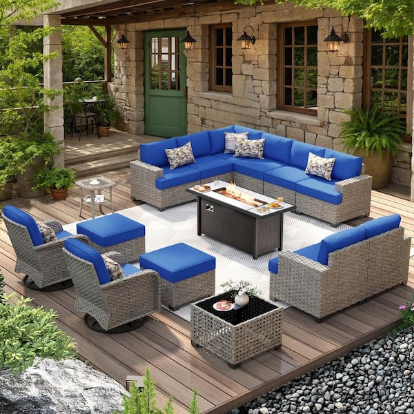 XIZZI Jubilation 15 Pieces Wicker Outdoor Patio Rectangular Fire Pit Set and Swivel Rocking Chairs with Navy Blue Cushions