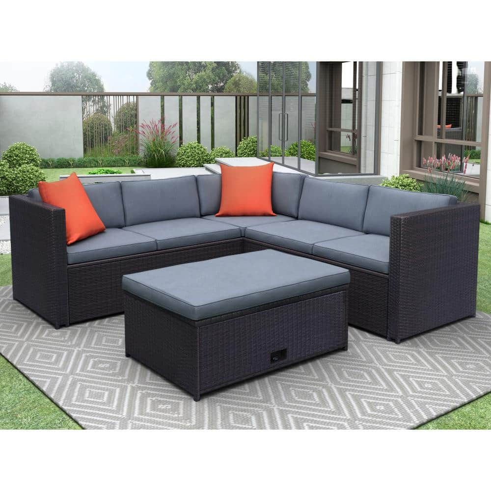 brown wicker outdoor sectional set with gray cushions