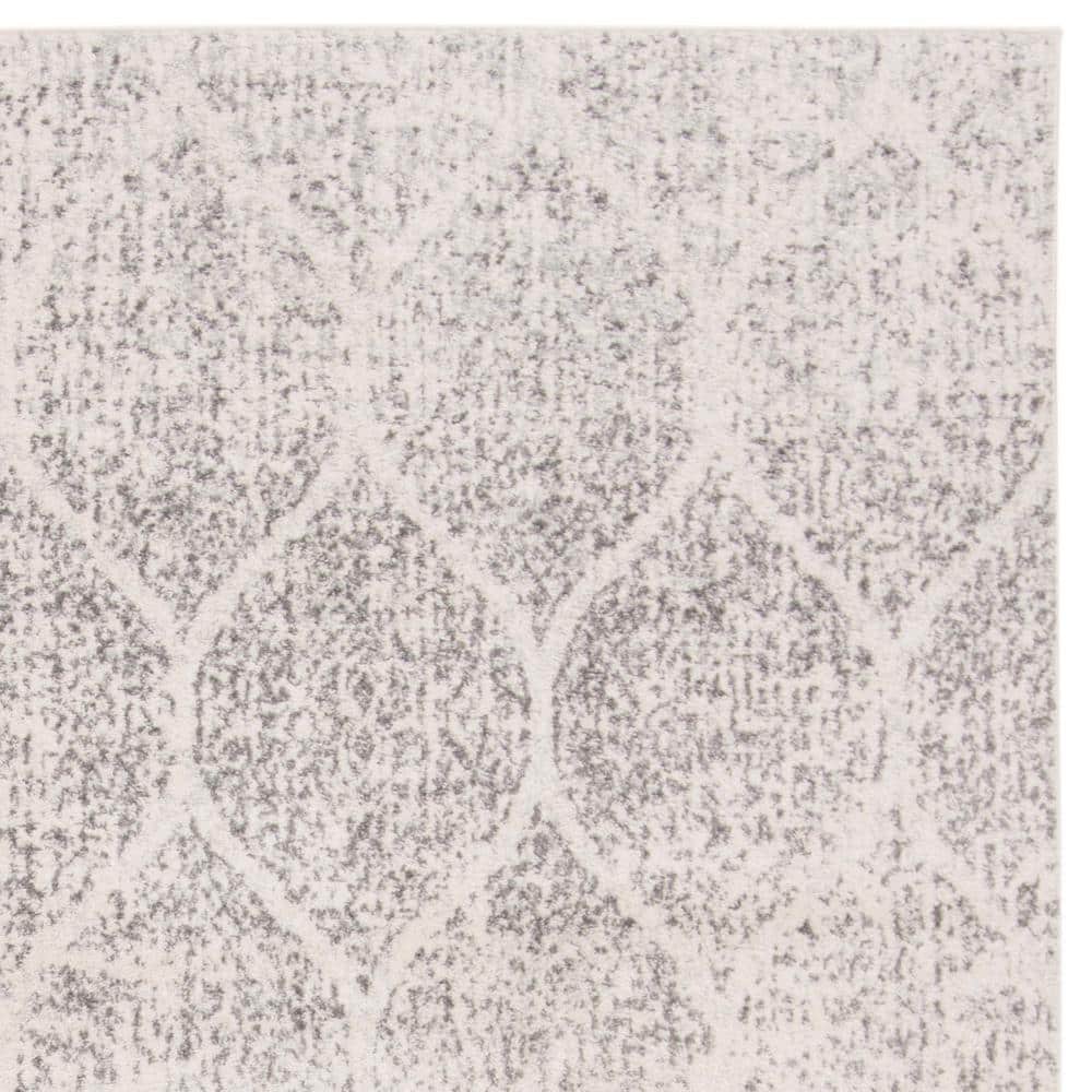 Ivory and Silver Geometric 8' x 10' Synthetic Area Rug
