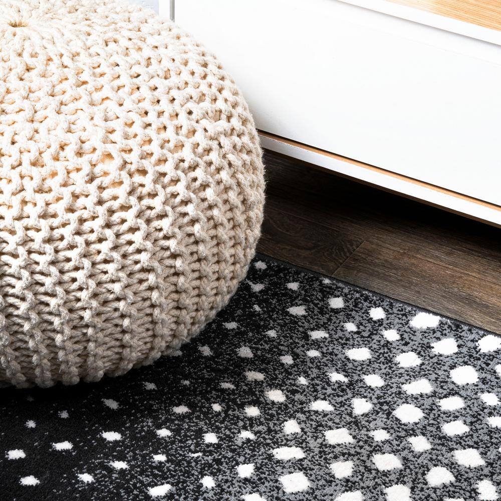 Abstract Antelope 8' x 10' Black and Ivory Synthetic Area Rug