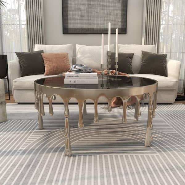Litton Lane 36 in. Silver Medium Round Aluminum Drip Coffee Table with Melting Designed Legs and Shaded Glass Top