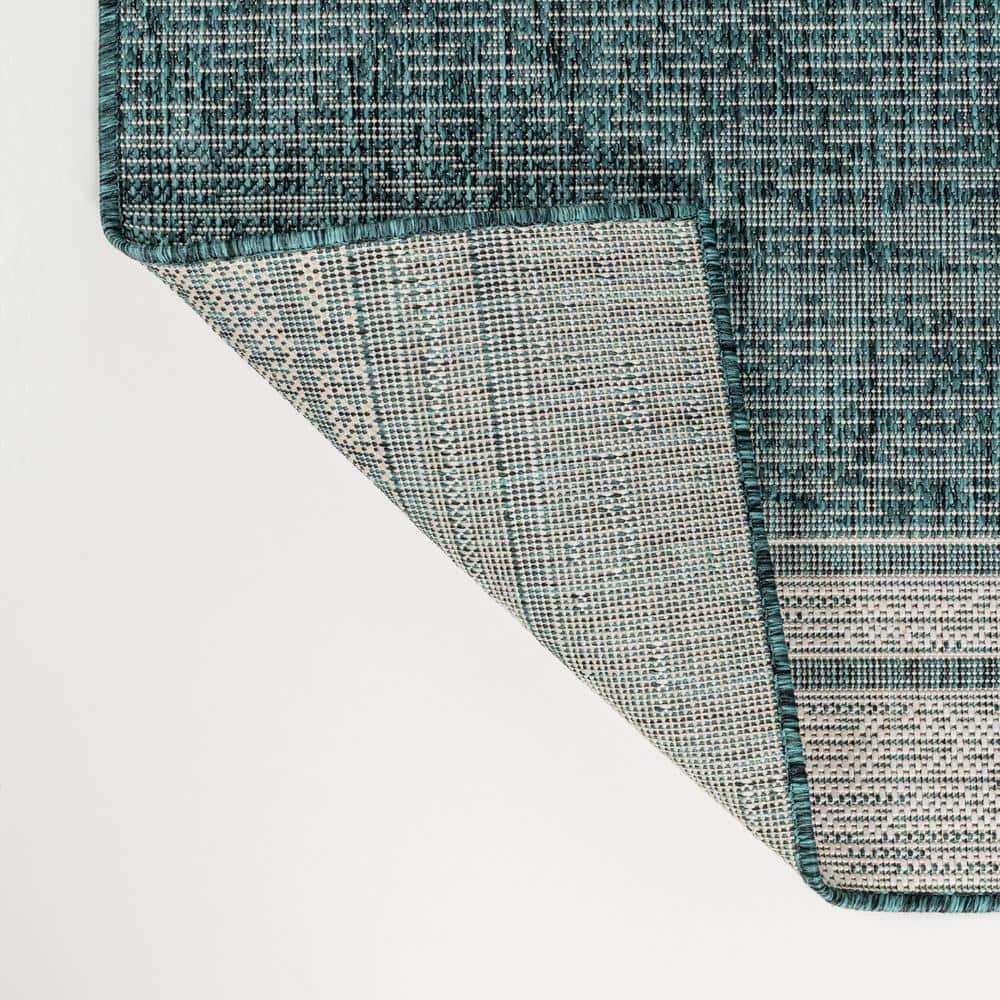 Turquoise and Cream 4' x 6' Solid Synthetic Area Rug