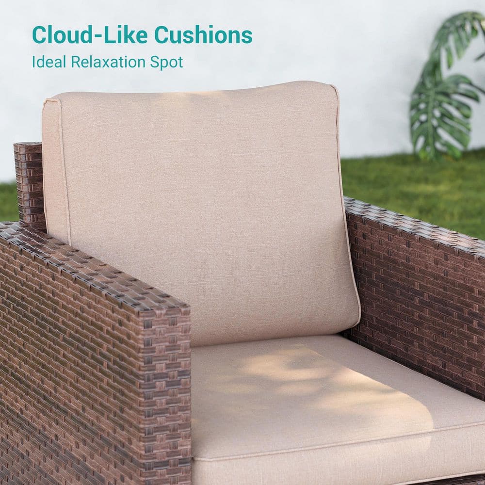 A close-up of a thick, sand-colored cushion on a brown wicker chair.