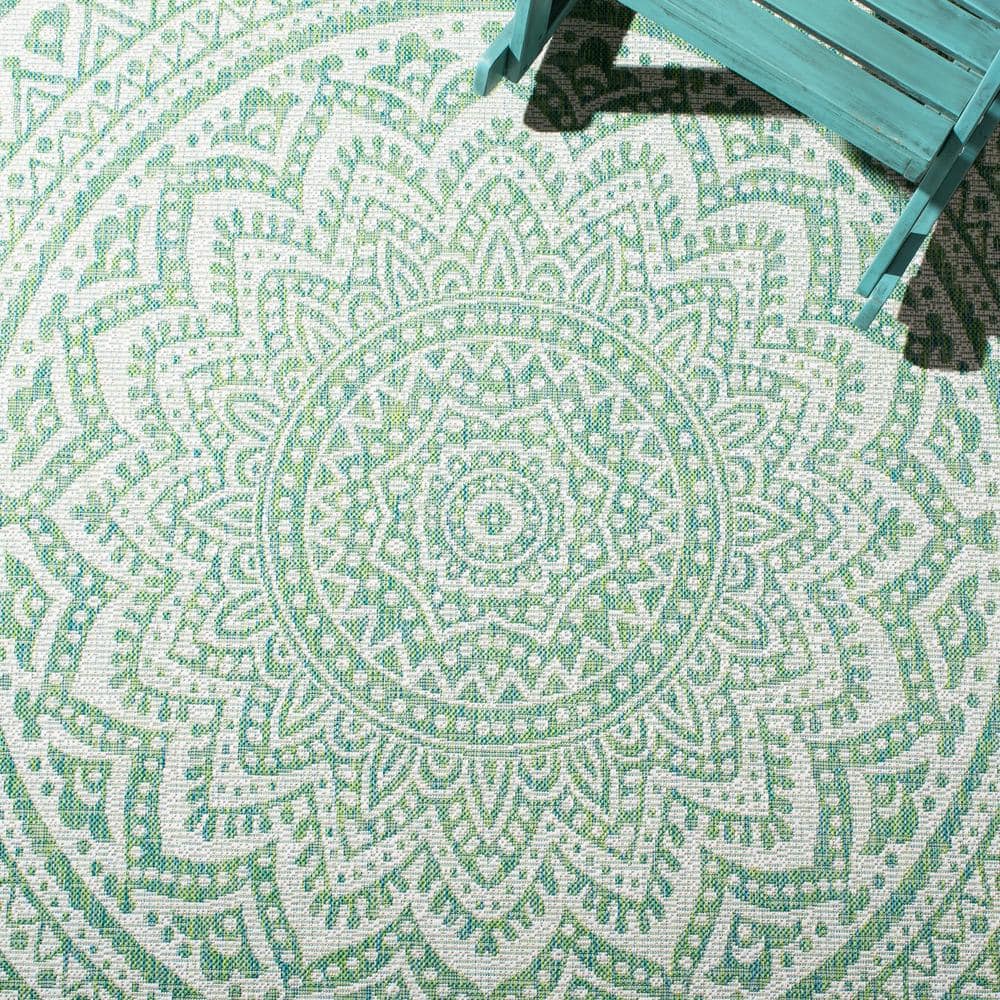 Ivory and Green Medallion 8' x 10' Synthetic Area Rug