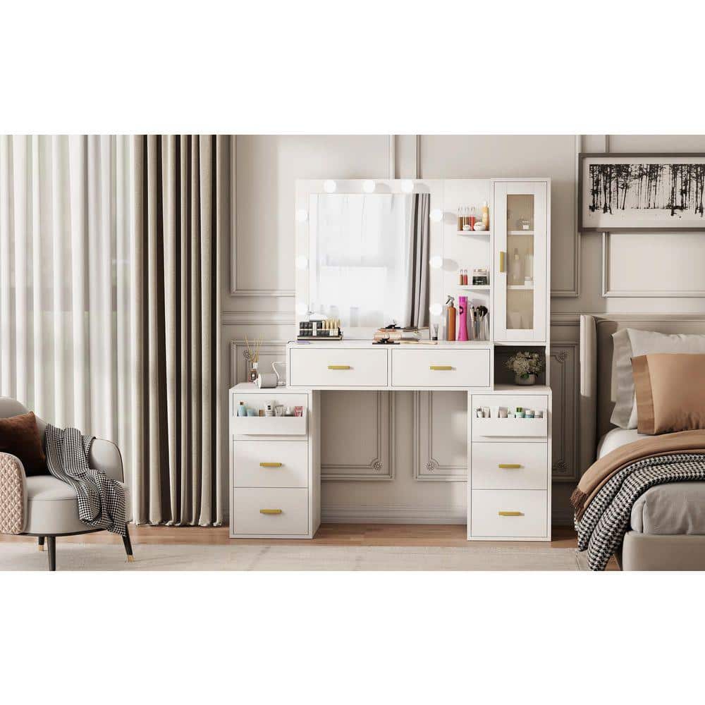 White makeup vanity set with LED mirror in a room.