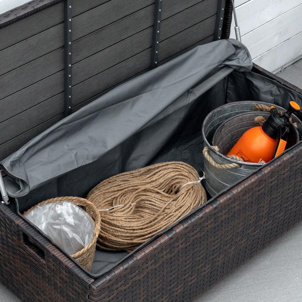 Outdoor Brown Wicker Storage Bench with Red Cushion