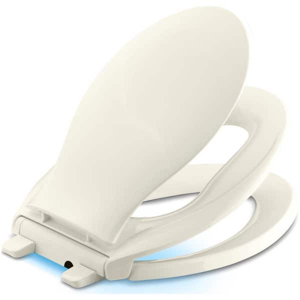 KOHLER Transitions Nightlight Elongated Closed Front Toilet Seat in Biscuit