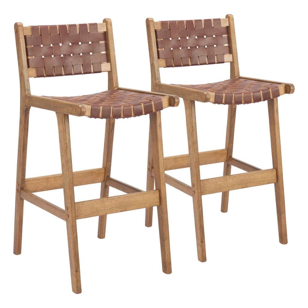Two wooden barstools with brown leather seats.