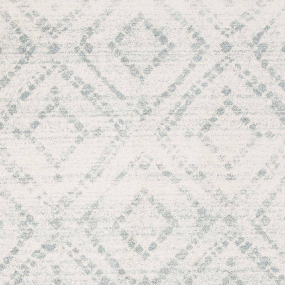 Ivory and Light Blue Geometric 9' x 12' Synthetic Area Rug