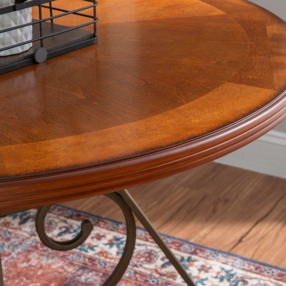 Close-up of the edge of a cherry wood dining table.