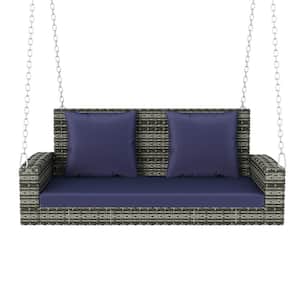 2-Person Gray Wicker Porch Swing with Blue Cushions and Pillows