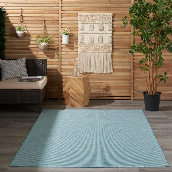 https://images.thdstatic.com/productImages/f2796bbf-bbee-50e9-9882-57aa59d225a2/svn/aqua-nourison-outdoor-rugs-790736-fa_600.jpg