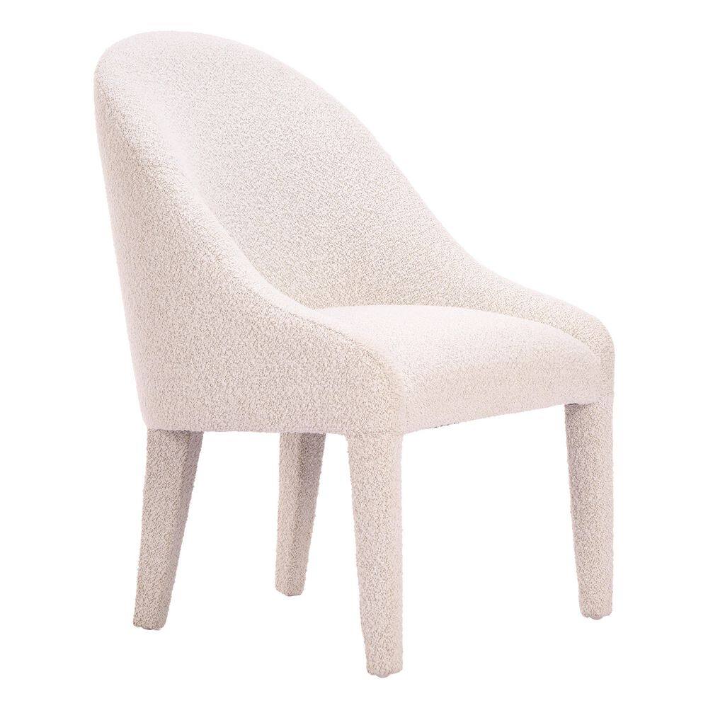 Three-quarter view of an ivory shearling-style upholstered dining chair.