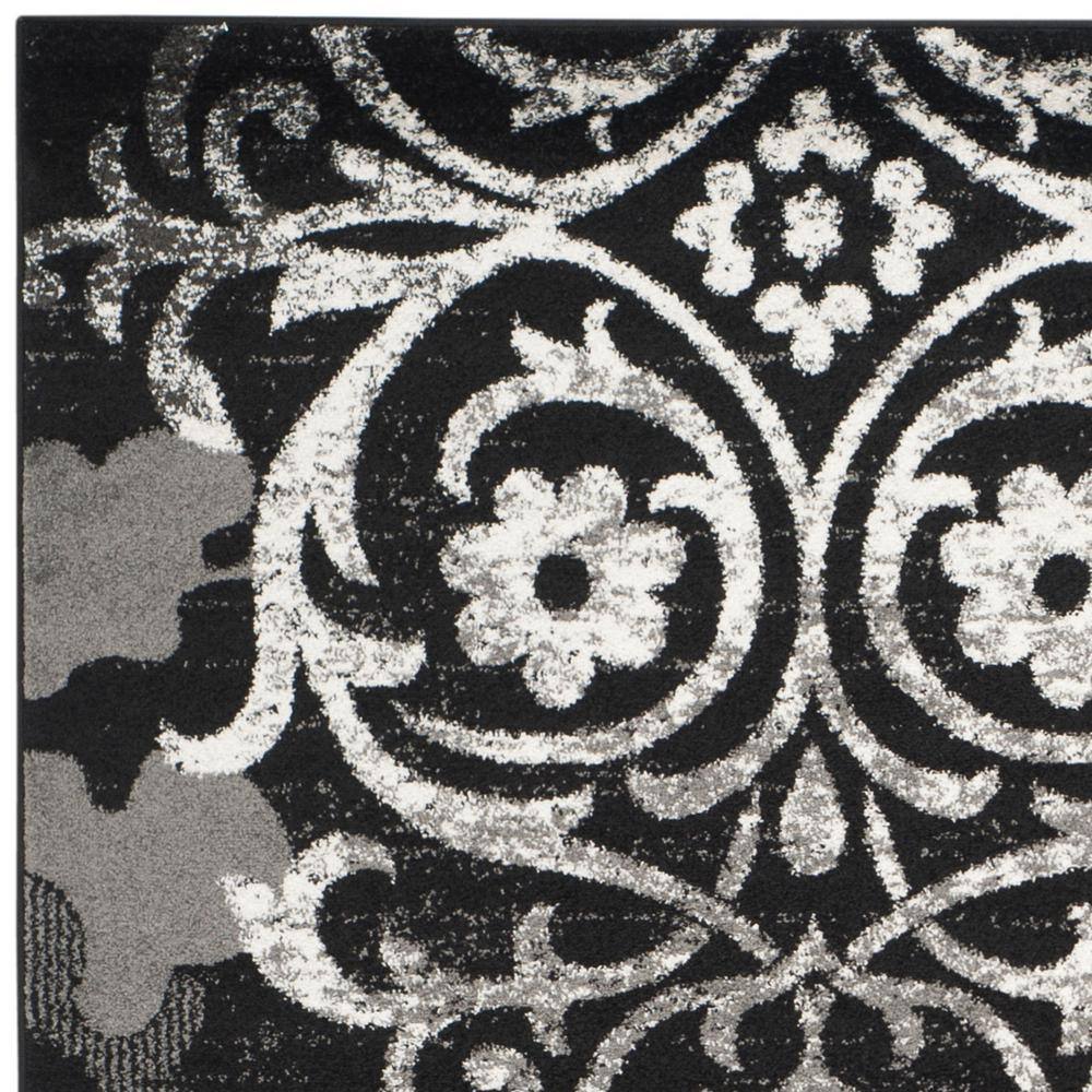 Elegant Black/Silver 9' x 12' Reversible Synthetic Area Rug