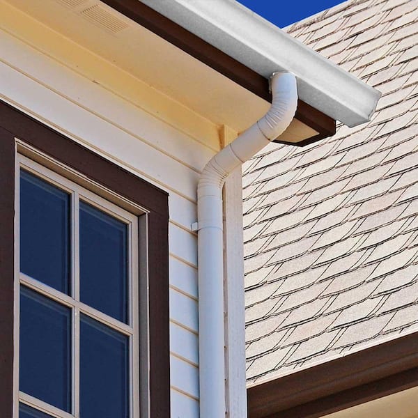 Downspout connected to the gutters and leading down the home's exterior.