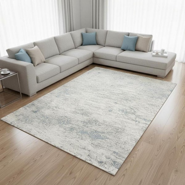 8' X 11' Cream And Blue Abstract Area Rug