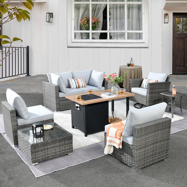 Daffodil Y Gray 8-Piece Wicker Patio Storage Fire Pit Conversation Set with a Swivel Rocking Chair and Gray Cushions