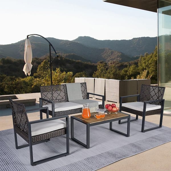 4-Piece Wicker Outdoor Patio Furniture Set with Acacia Wood Table Top and Beige Cushions