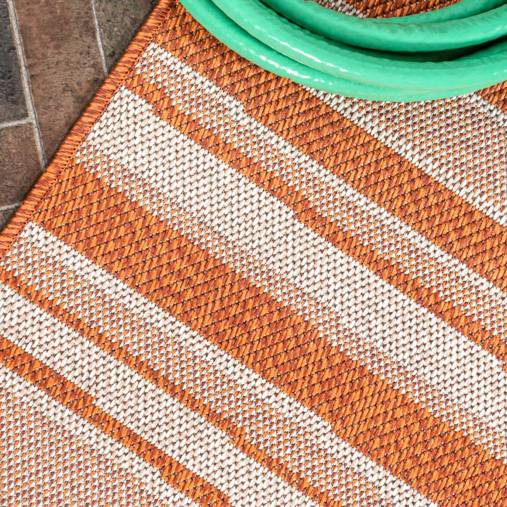 Castara Chic Orange & Cream Striped Synthetic 5x8 Area Rug
