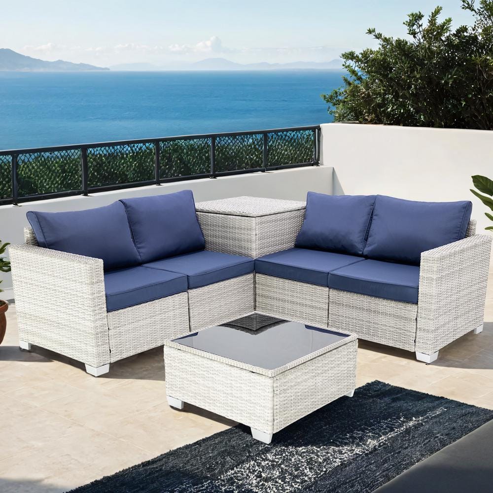 4-Piece Gray Wicker Outdoor Sectional Set with Dark Blue Cushions and Stora
