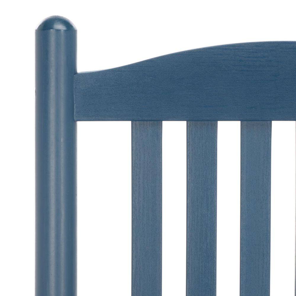 Close-up of the top corner of a navy blue rocking chair back.