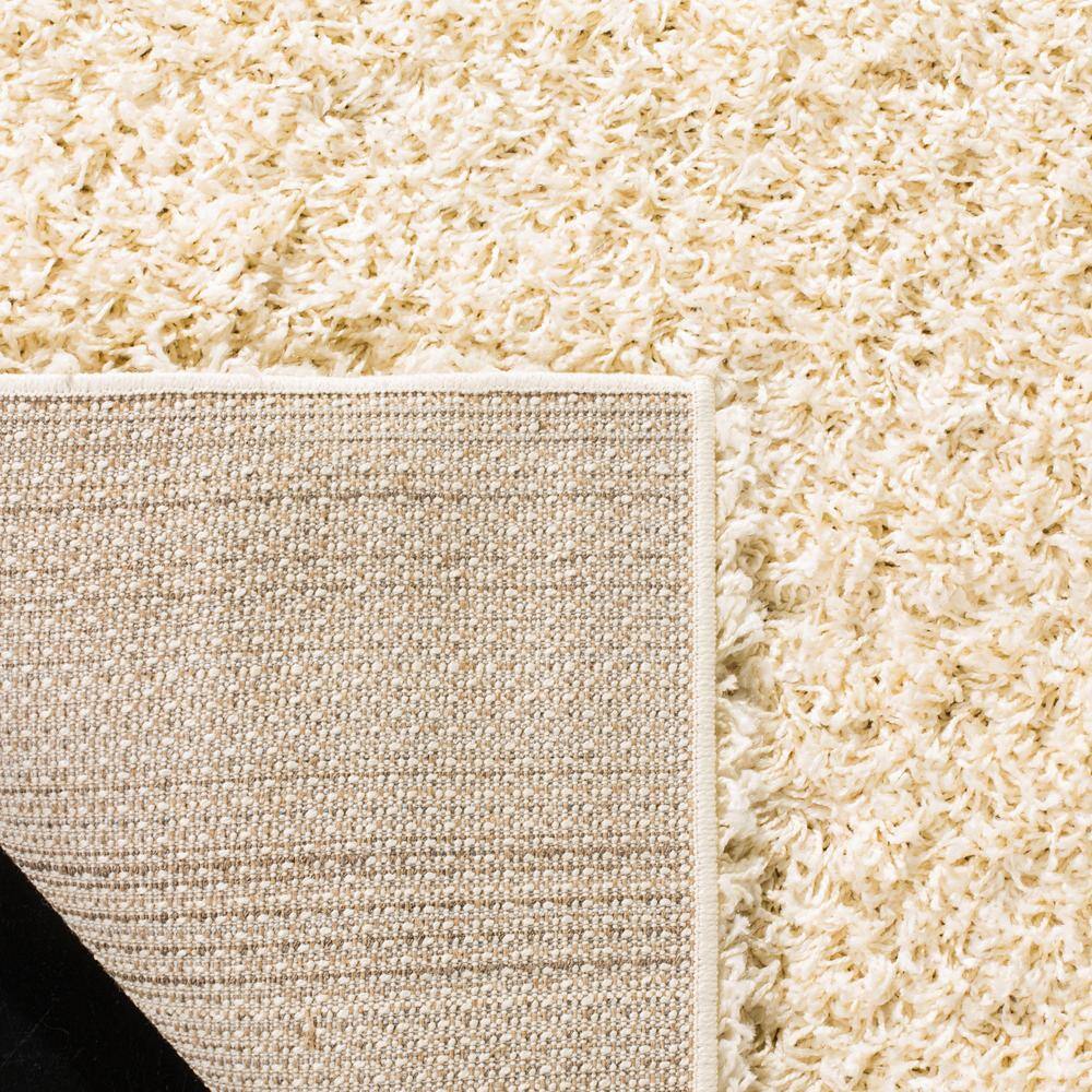 Ivory 9' x 12' Shag Wool and Synthetic Rug
