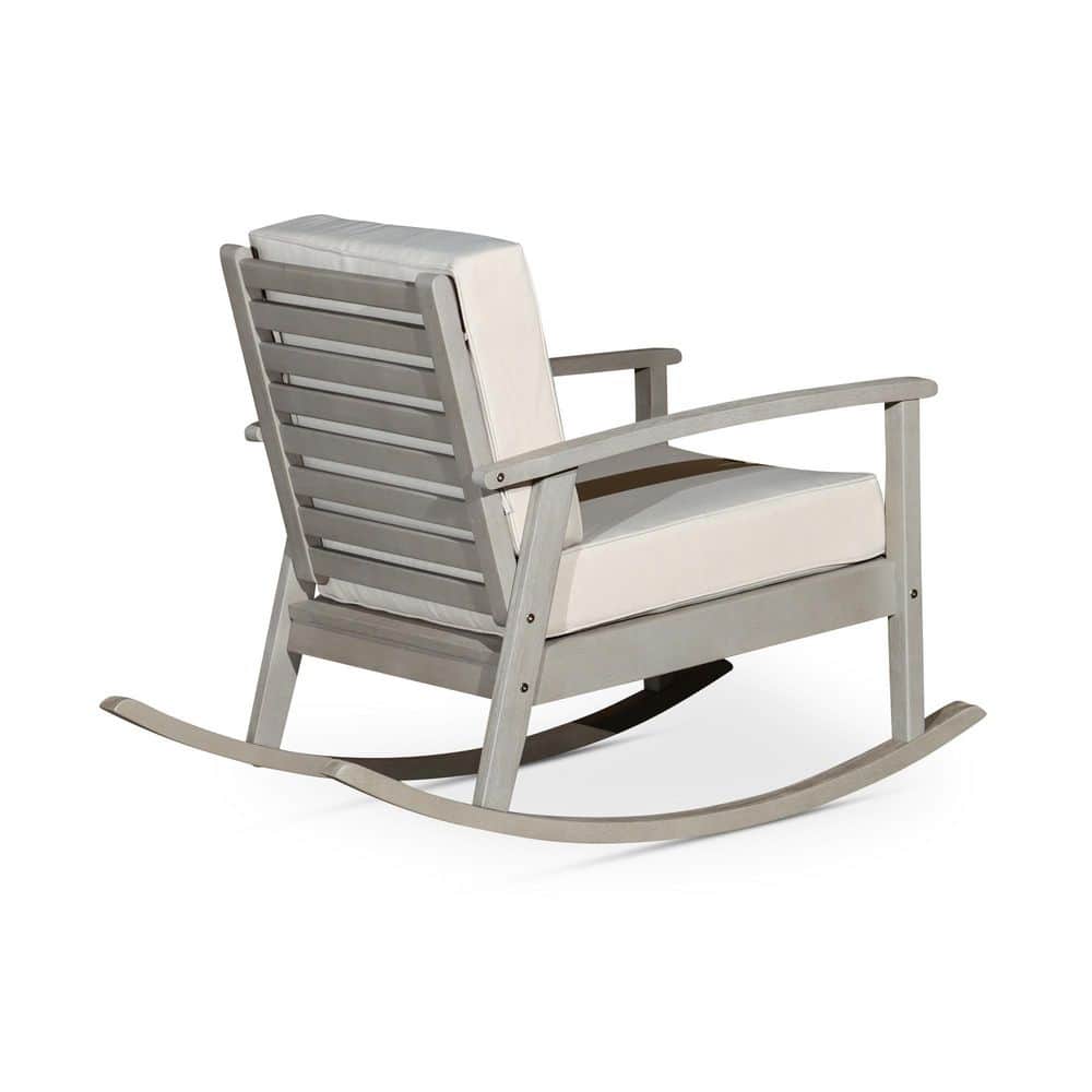 Gray wood rocking chair with beige cushion on a white background.