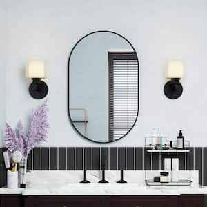 20 in. W x 32 in. H Oval Framed Wall Mount Bathroom Vanity Mirror in Black