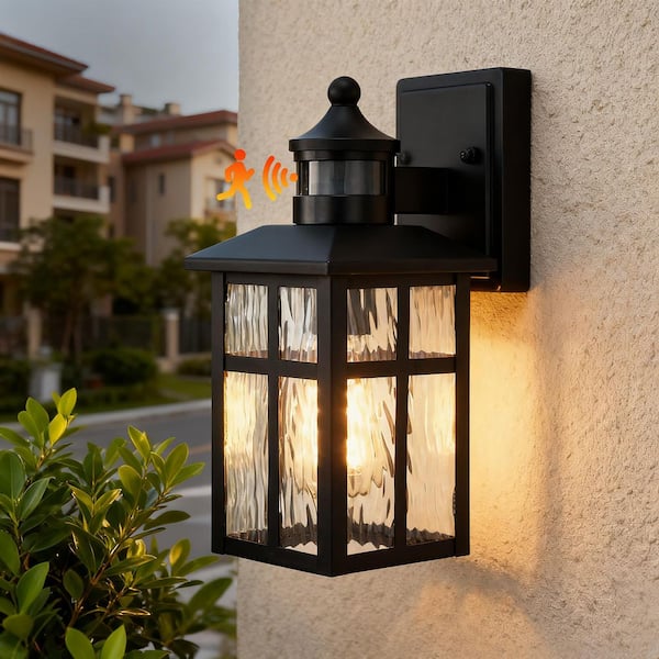 12 in. Matte Black 1-Light Motion Sensing Outdoor Wall Sconce with Dusk to Dawn and Water Wave Glass