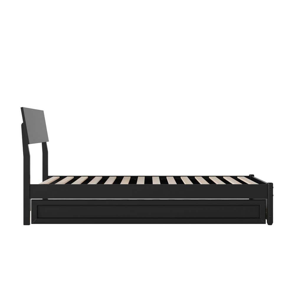 Side view of a black wood twin platform bed frame with a trundle.