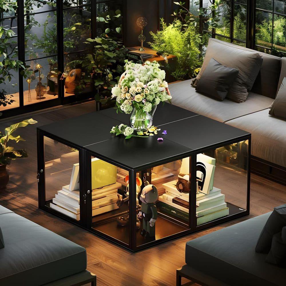 Four black display cabinets arranged as a square coffee table, illuminated with yellow LED lights.