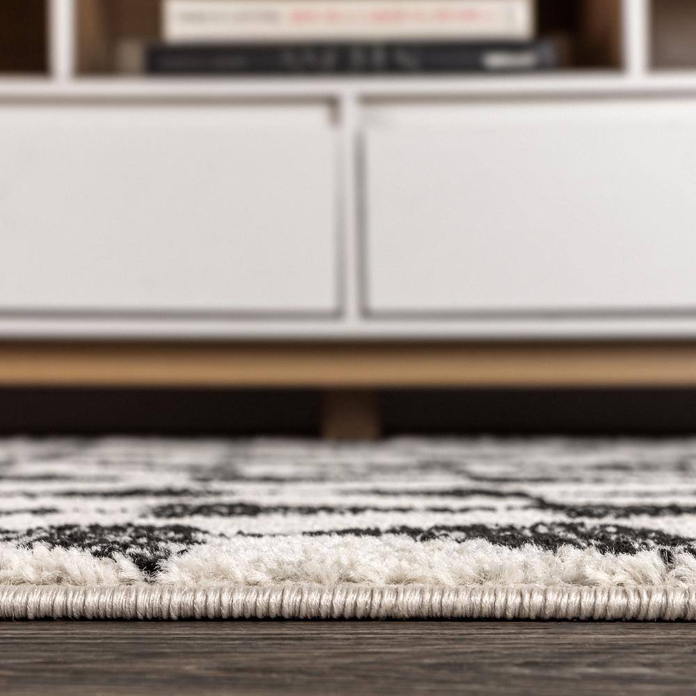 Aisha Cream and Black Geometric 10' x 14' Synthetic Area Rug