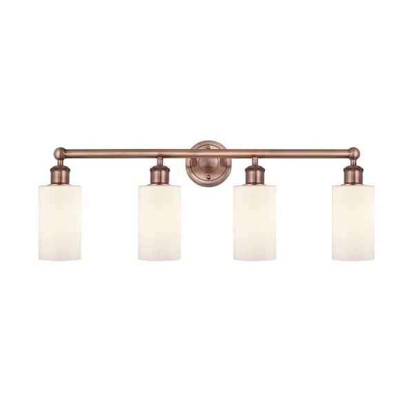 Clymer 30.88 in. 4-Light Antique Copper Vanity Light with Glass Shade