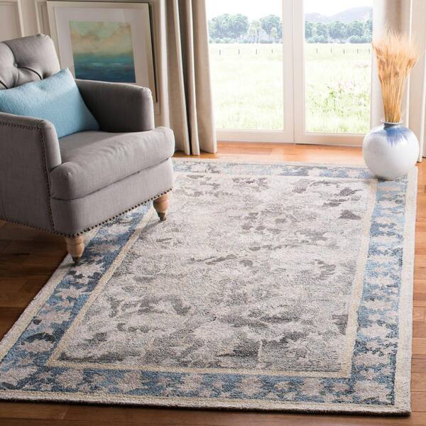 Abstract Beige/Blue 5 ft. x 8 ft. Abstract Border Area Rug