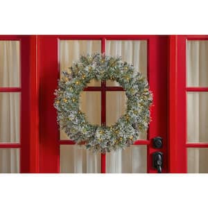 30 in. Battery Operated Pre-Lit LED Sparkling Amelia Pine Artificial Christmas Wreath with Flock, Glitter and Pinecones