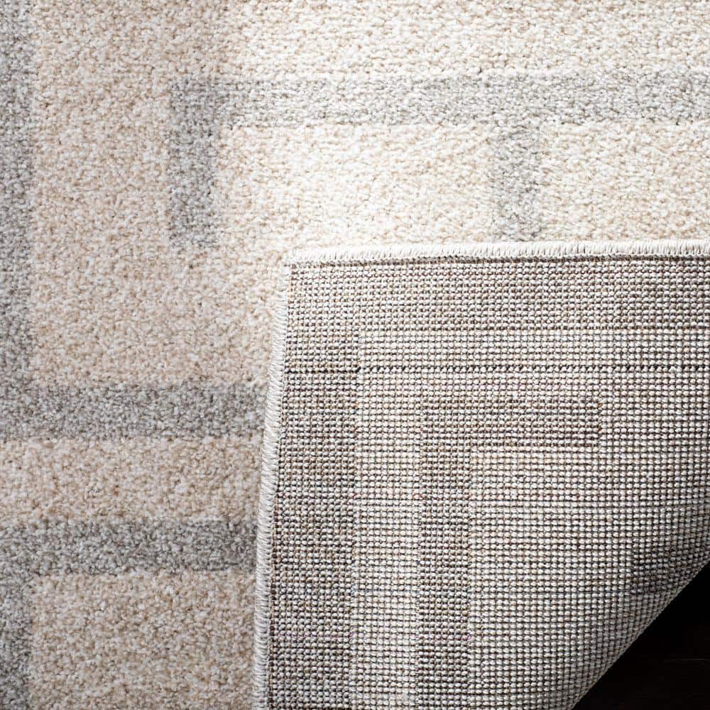 Ivory and Light Gray Rectangular 9' x 12' Synthetic Rug