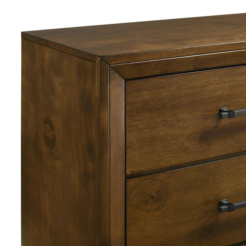 Close-up detail of the Ballard walnut brown wood dresser corner and drawer.