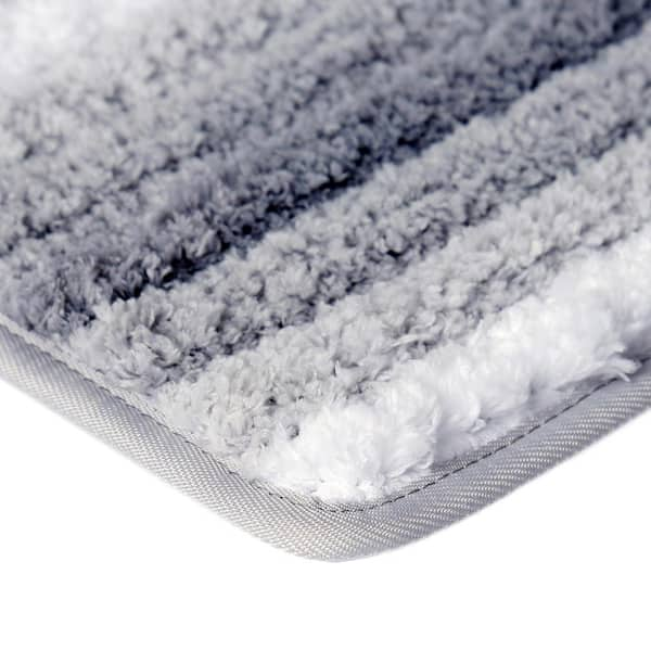 https://images.thdstatic.com/productImages/f48a7acf-7cc2-48da-8433-8cc5e4827d0d/svn/gray-home-dynamix-bathroom-rugs-bath-mats-3-dt03-451-c3_600.jpg