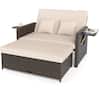 Outdoor day bed with beige cushions and storage ottoman on a plain background.