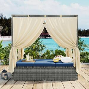 Wicker Outdoor Day Bed with Blue Cushions and Curtain