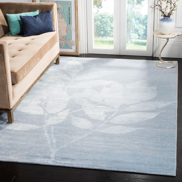 Tibetan 6 ft. x 9 ft. Light Blue Distressed Floral Area Rug